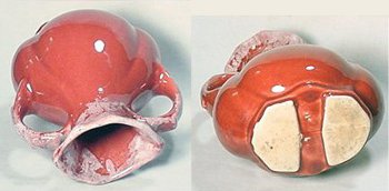Sunset red American Bisque vase with white drip glaze on mouth. Well defined wedge shaped foot.