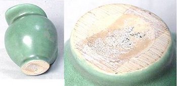 Green Camark creamer with clear cutting tool marks on foot. Marks are lines across the dry bottom.