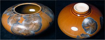 Brown contemporary pot with large blue crystal formations inside glaze.