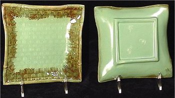 Lime Guppy's Island Ware plate with darker drip glaze on edge to highlight inner pattern. Foot has three clear stilt marks from firing.