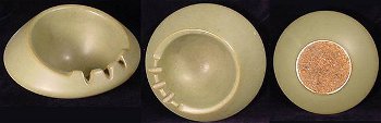 Cork-bottomed Hyalyn tan ashtray with a sloping bowl and three cigarette holders.