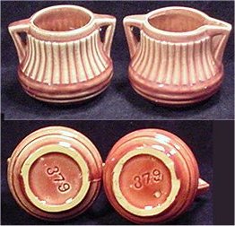 McCoy red and off-white pot with visible 379 marking and firing pin flaws.
