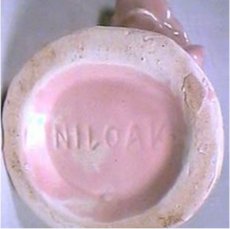 Niloak white clay bowl clearly marked with a large base.