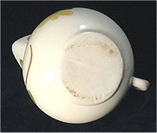 White Purinton Pottery pitcher with faint bisecting seam on base.