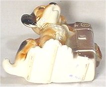 Royal Copley planter (dog with suitcase) with clearly defined bars on foot.