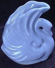 Blue swan planter with wings extended up by Alamo Pottery of Texas.