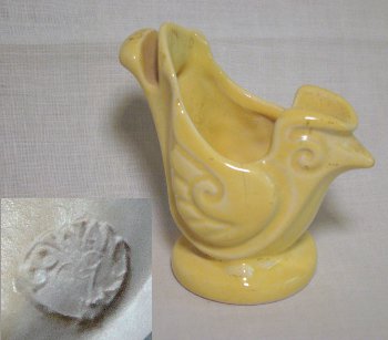 Yellow artistic bird ashtray with mark by Cowan, from the bridge party favor series (1926-1928).