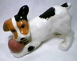 Russell Terrier puppy playing with ball and looking up. Dog figurine by Robert Simmons.