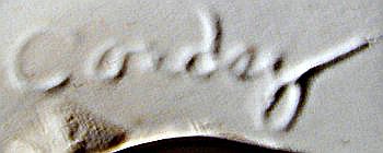 Script mark on bottom of Cordey China figurine.