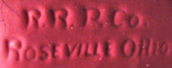 R.R.P.Co. marked in mold on drip glaze bowl with fuchsia glaze.