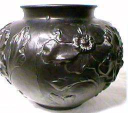 Tiffin black satin glass bowl with raised flower design.